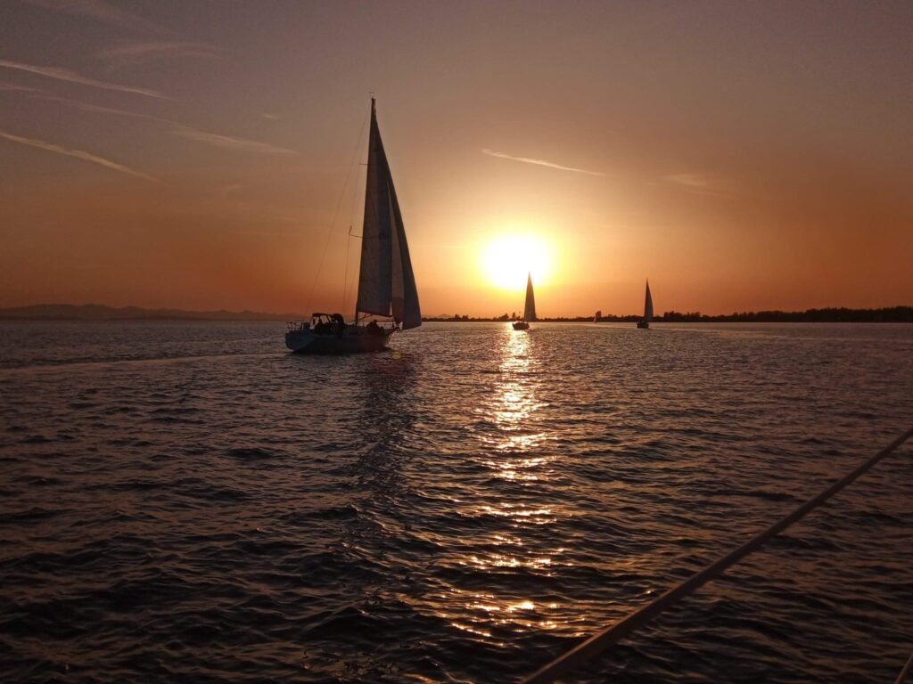 sailing - sunset and sunny skies ahead